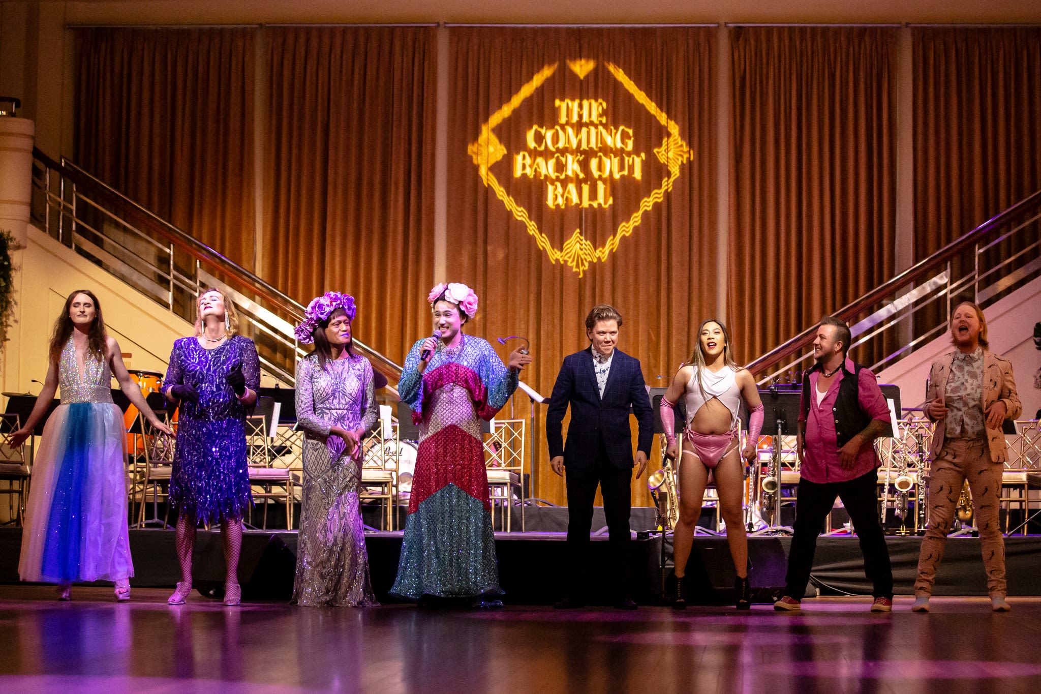 People on stage at the Coming Back Out Ball